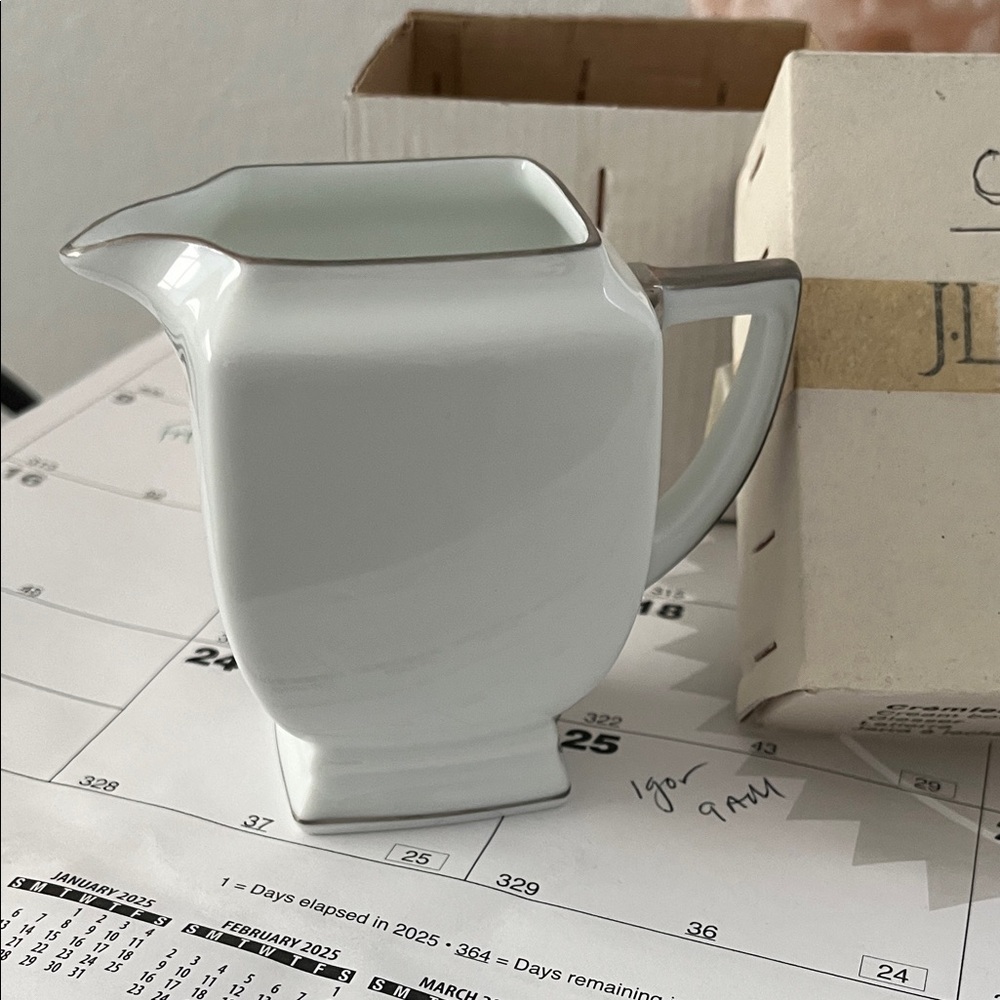 Elegant White Ceramic Pitcher with Gray Trim